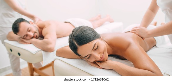 beautiful couple during back massage, joint day at the spa. Man and woman enjoy a massage