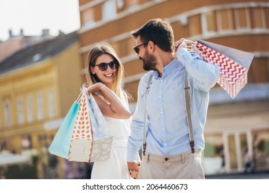 Beautiful couple enjoying shopping together in the city. - Powered by Shutterstock