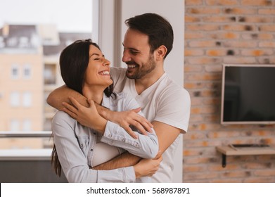 Beautiful couple hugging and looking at each other