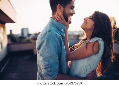 Beautiful Couple In Love Dating Outdoors And Smiling