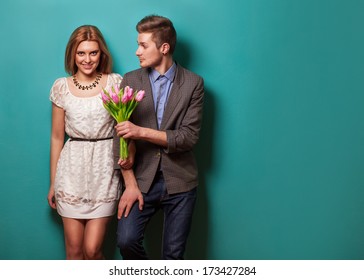 Beautiful Couple In Love With Flowers Tulips.Valentine's Day