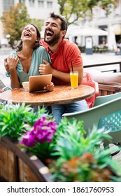 Beautiful Couple In Love Having Fun On A Date In A Cafe