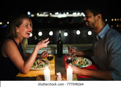 Beautiful Couple In Love Having Romantic Dinner At Night