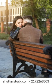 Beautiful Couple In Love On Romantic Dating In Summer City Park, Sensual Relationship Of Young Man And Woman On Bench, Candid Lifestyle, Vertical Image