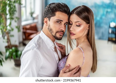 Beautiful Couple In Love Posing Together, Hugging And Dancing. Romantic Date. Real People Emotions. Closeup Portraits.