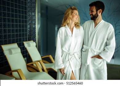 Beautiful couple relaxing in spa center