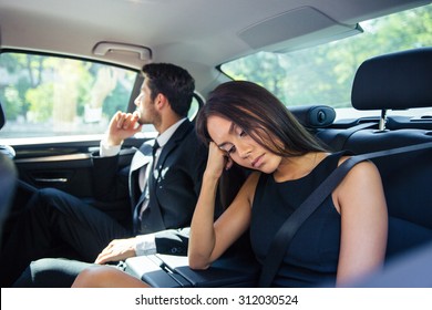 Beautiful Couple Resting On Back Seat In Car