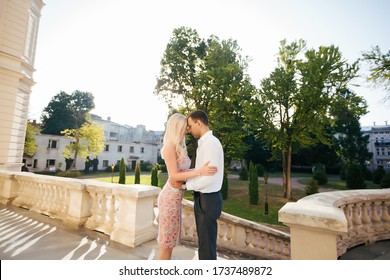 Beautiful Couple Standing On A Chic Balcony