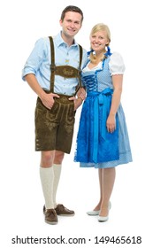 beautiful couple in traditional bavarian tracht isolated on white
