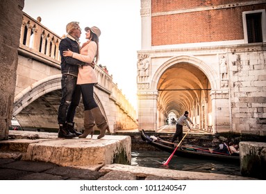 Beautiful couple in Venice, Italy - Lovers on a romantic date and kissing in Saint Mark Square, Venice