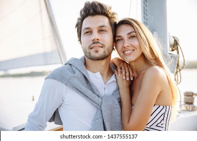 Beautiful Couple Walking On A Yacht Under Sail