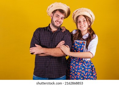 Beautiful Couple Wearing Typical Clothes For The Festa Junina. Arms Crossed, Confident.