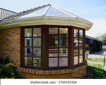 Beautiful cozy sunny solarium conservatory sun room great extention of a house - Shutterstock ID 1769155334