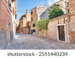 Beautiful cozy vintage courtyard in Venice, Italy. Classic Venetian houses, Italy. Traditional Italian architecture