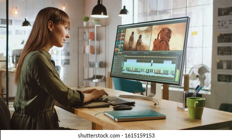 Beautiful and Creative Brunette Female Video Editor Works with Footage on Her Personal Computer with Big Display. She Works in a Cool Office Loft. - Shutterstock ID 1615159153