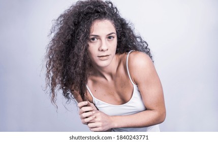 Beautiful Curly Haired Female Model Posing In Studio. Isolated