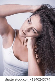 Beautiful Curly Haired Female Model Posing In Studio. Isolated