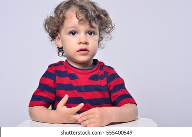 Beautiful Curly Toddler Looking Up, Big Eyes Scared Boy 