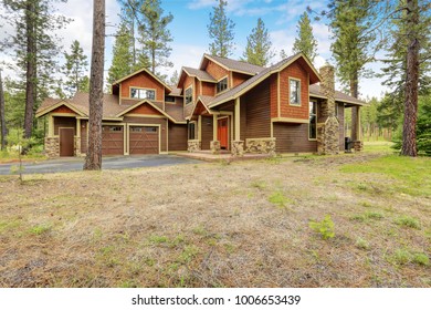 Beautiful custom made home exterior accented with mixed wood and stone siding. Northwest, USA