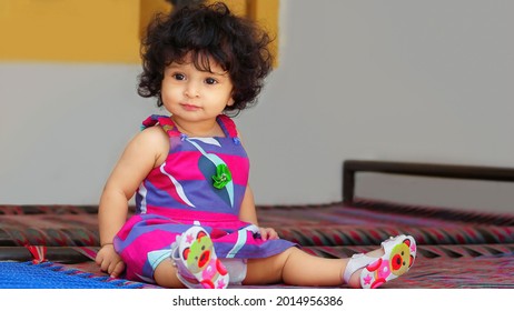 Beautiful Cute Asain Baby Girl In Pink Clothes