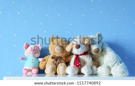 Beautiful cute family toys on the table in light blue starry room