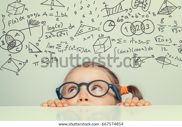 beautiful cute little girl with math formulas\
and problems