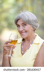 Beautiful Cute Old Woman Drinking Wine Close-up