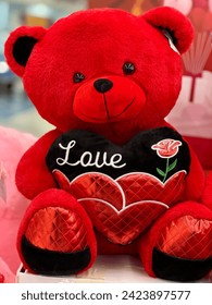 Beautiful Cute Red and black Velvet Teddy Bear with holding heart written love