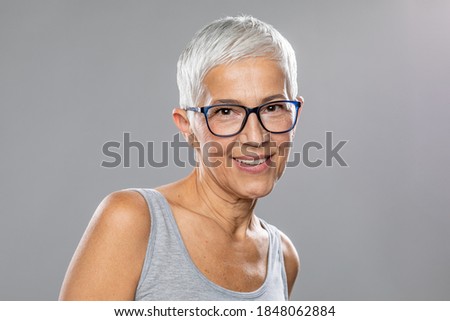 Similar – Image, Stock Photo Elderly woman in yellow top with a warm smile