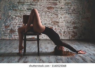 Beautiful dancer. Girl model. Relaxation. Stretching. Sporting Movements. sport lifestyle.  meditation. the girl is sitting on a chair
