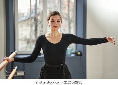 a beautiful dancer is practicing in a dance class. beauty elegance, grace of dance.