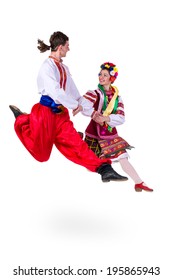 Beautiful Dancing Couple In Ukrainian Polish National Traditional Costume Clothes Happy Smile, Full Length Portrait Isolated Over White Background