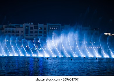 beautiful dancing fountain illuminated at night