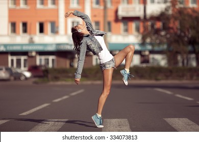 Beautiful Dancing Girl On A Street