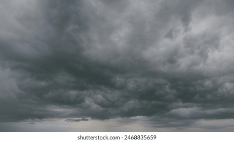 Beautiful dark dramatic sky with stormy clouds before rain or snow. Thunderstorm heaven landscape. Timelapse. - Powered by Shutterstock