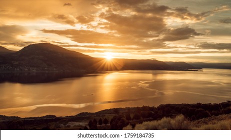 A Beautiful Dark And Golden Sunset Over Okanagan Lake In Penticton BC