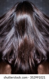 Beautiful Dark Shiny Long Woman Hair In Motion, Back View, Studio Shot