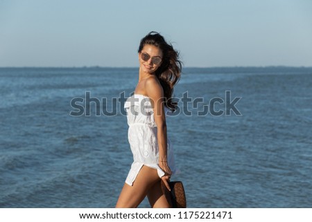 Similar – Young surfer woman with top and bikini kissing surfboard