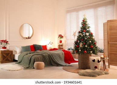 Beautiful Decorated Christmas Tree With Fairy Lights In Bedroom. Interior Design