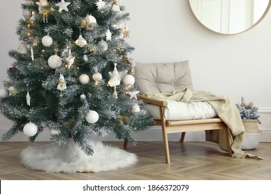 Beautiful Decorated Christmas Tree With Skirt In Room