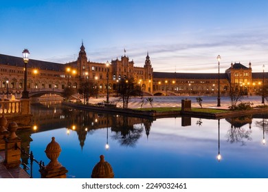 The beautiful decorated Plaza de España (English: Spanish Square) during an colourful sunrise is a touristic spot in a park in the centre of Seville, Spain, built in 1928 for the 1929 world exposition - Powered by Shutterstock