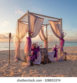 Beautiful Decorated Romantic Wedding Table On Sandy Tropical Caribbean Beach At Sunset