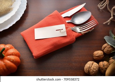 Beautiful Decoration For Autumn Table Scape And Settings: White Plate, Decorative Pumpkin And Orange Linen Napkin With Cutlery. Fall Harvest Concept. Thanksgiving Day Festive Background. 