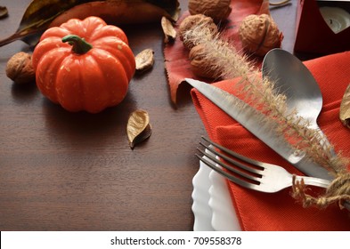 Beautiful Decoration For Autumn Table Scape And Settings: White Plate, Decorative Pumpkin And Orange Linen Napkin With Cutlery. Fall Harvest Concept. Thanksgiving Day Festive Background.Copy Space