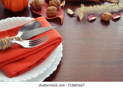 Beautiful Decoration For Autumn Table Scape And Settings: White Plate, Decorative Pumpkin And Orange Linen Napkin With Cutlery. Fall Harvest Concept. Thanksgiving Day Festive Background 