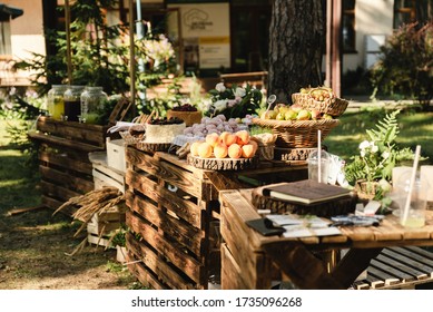 A Beautiful Decoration Of The Wedding Buffet Table Outdoors With Sweets, Fresh Flowers On Wooden Coasters,an Abundance Of Sweets On Wooden Coasters.,buffet Reception In Nature.