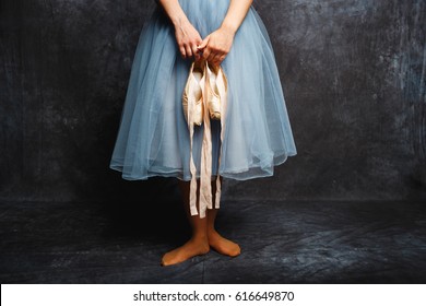 Beautiful and delicate ballerina in a studio on gray background - Powered by Shutterstock