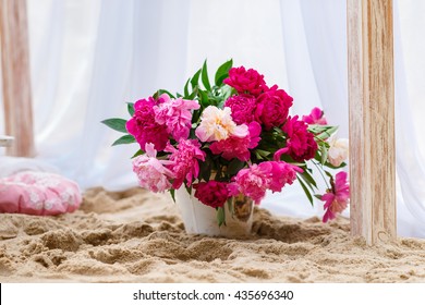 Beautiful, Delicate Wedding Decorations With Candles And Fresh Flowers On The Beach