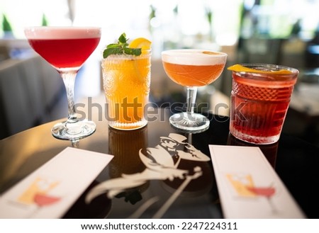 beautiful and delicious alcoholic cocktails prepared at the bar by the bartender