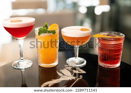 beautiful and delicious alcoholic cocktails prepared at the bar by the bartender